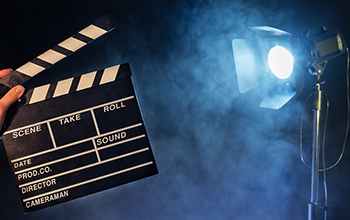 Movie clapperboard with spotlight