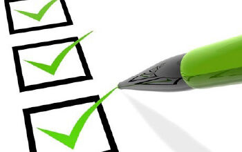 Green pen checking all the checkboxes