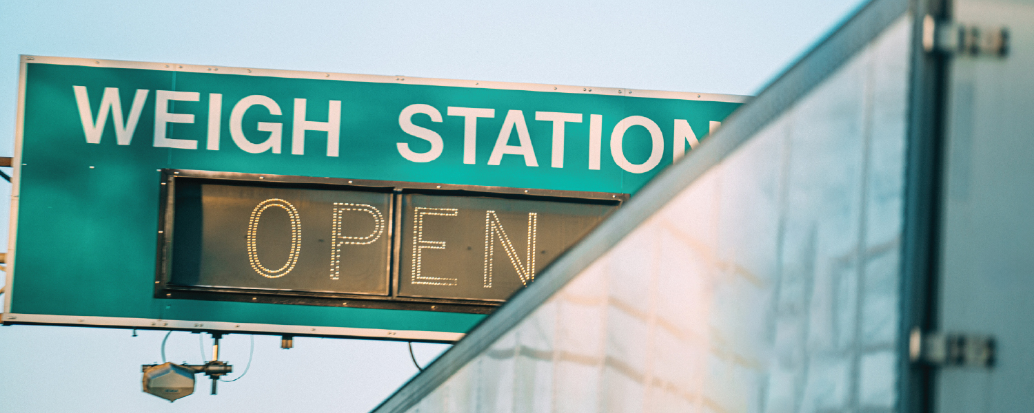 A weigh station sign