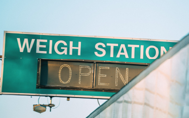 A weigh station sign